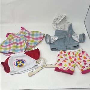 3 build a bear shirts, and a pair of shorts and hanger